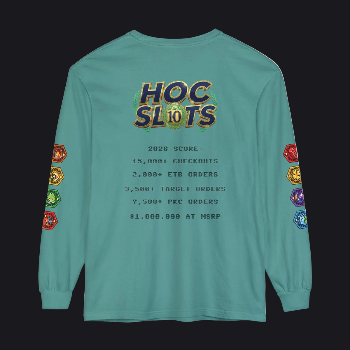 A teal long-sleeve t-shirt with a humorous 'HOC Slots' gaming score printed on the back, featuring colorful dice graphics on the sleeves and a detailed text list of gaming achievements in the center.