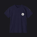 Black t-shirt with a small green logo on a gray background