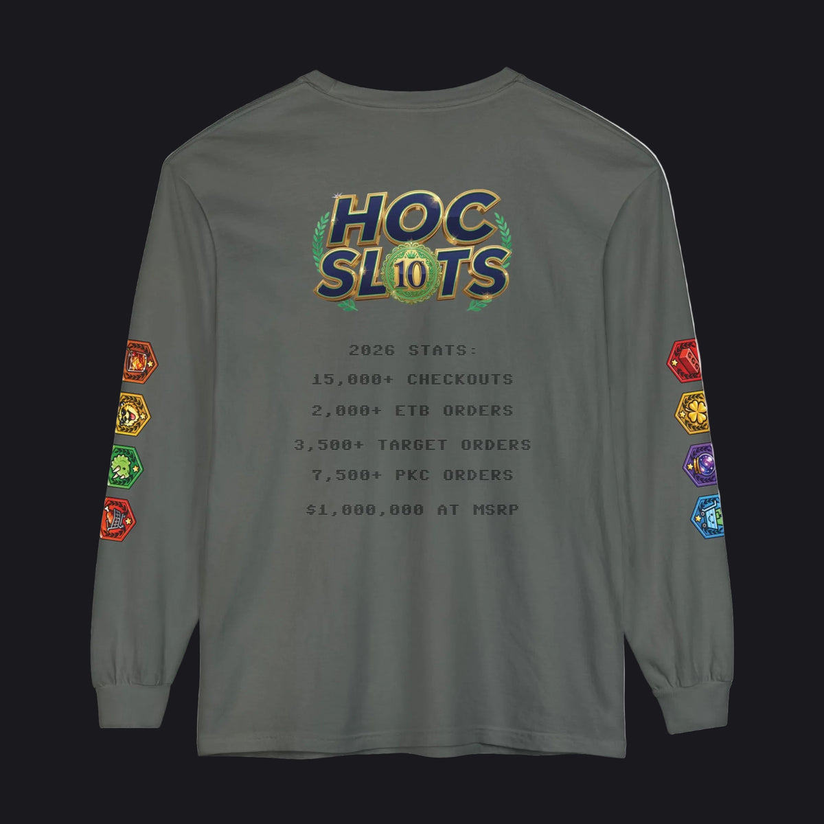 A dark gray long-sleeve t-shirt with a colorful 'HOC SLOTS 10' graphic on the chest and multicolored hexagonal patch graphics on both sleeves, displayed against a solid white background.