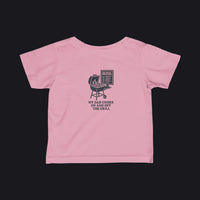 A pink short-sleeve baby t-shirt shown from the back, featuring a black graphic of a grill and the text 'MY DAD COOKS ON AND OFF THE GRILL'.