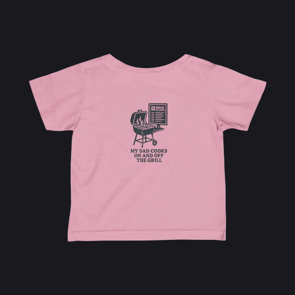 A pink short-sleeve baby t-shirt shown from the back, featuring a black graphic of a grill and the text 'MY DAD COOKS ON AND OFF THE GRILL'.