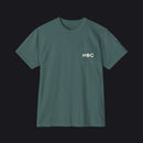 A dark green crewneck t-shirt with a left chest pocket featuring the white text 'HOC' printed on it, displayed against a solid white background.