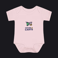A light pink short-sleeve baby bodysuit with a 'HOUSE OF CARTS' graphic printed on the chest, displayed on a clean white background.