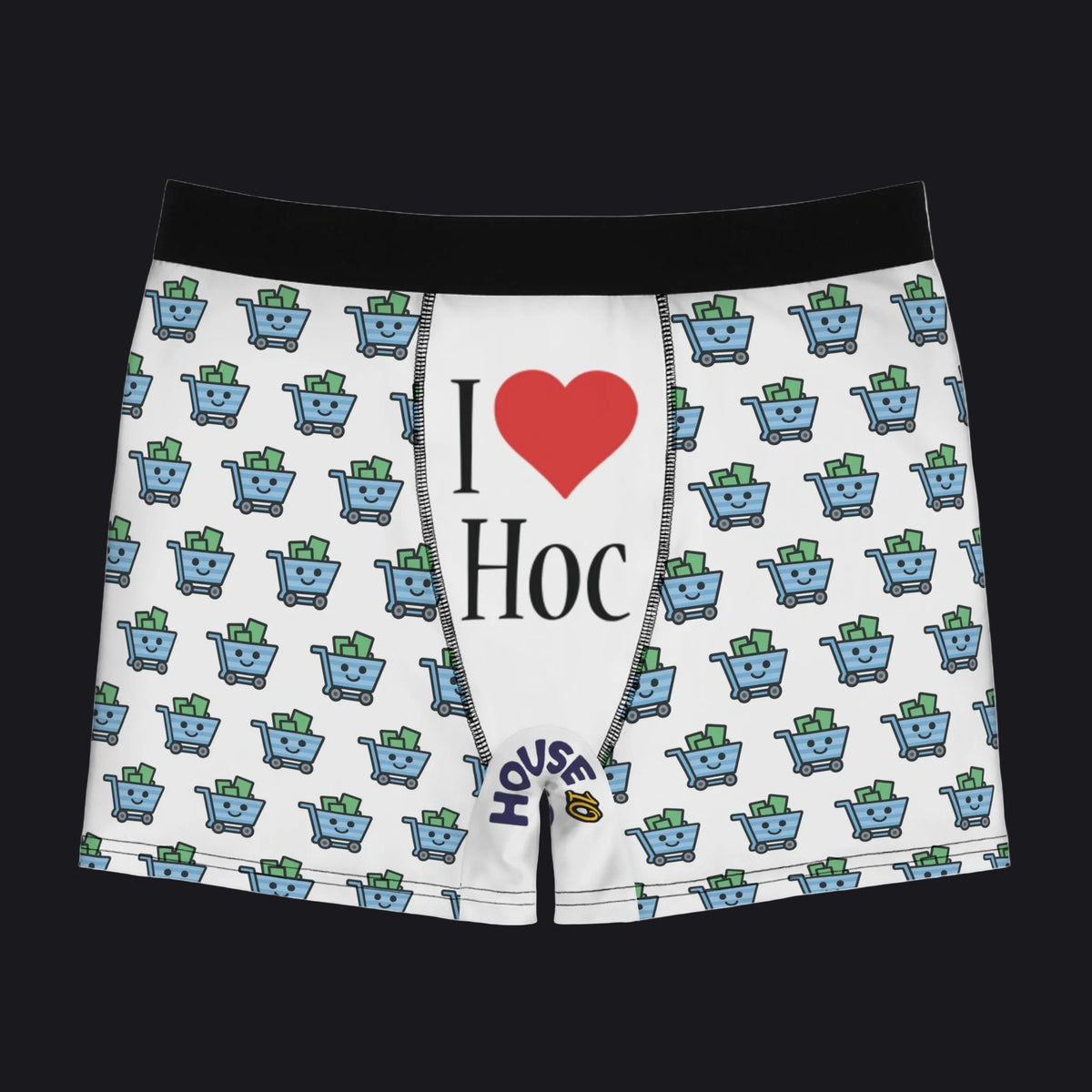 White boxer briefs with a black waistband, featuring a repeating pattern of blue shopping carts with green cash and a central graphic that reads 'I ♥ Hoc' with 'House of Cards' branding near the hem.