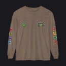 A brown long-sleeve t-shirt with 'HOC SLOTS' printed on the left chest, a green emblem on the right chest, and colorful game-piece graphics printed down both sleeves.