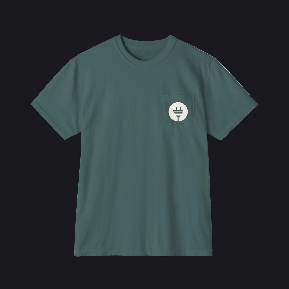 A dark teal green short-sleeve crewneck pocket t-shirt with a small circular chest graphic, displayed flat against a solid white background.