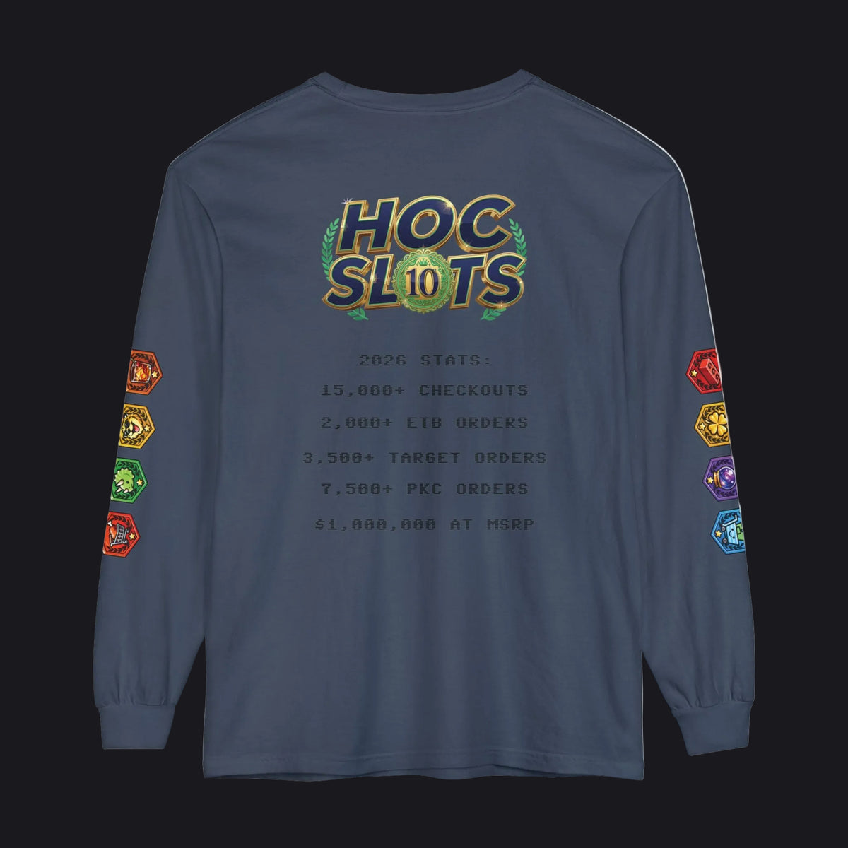 A navy blue long-sleeve t-shirt shown from the back, featuring a large 'HOC SLOTS 10' graphic with gold, green, and orange accents, and various colorful hexagonal game-themed icons printed down both sleeves.