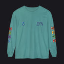 A teal long-sleeve t-shirt with 'HOC SLOTS' printed on the left chest, a small emblem on the right chest, and colorful flag graphics running down both sleeves.