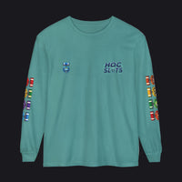 A teal long-sleeve t-shirt with 'HOC SLOTS' printed on the left chest, a small emblem on the right chest, and colorful flag graphics running down both sleeves.