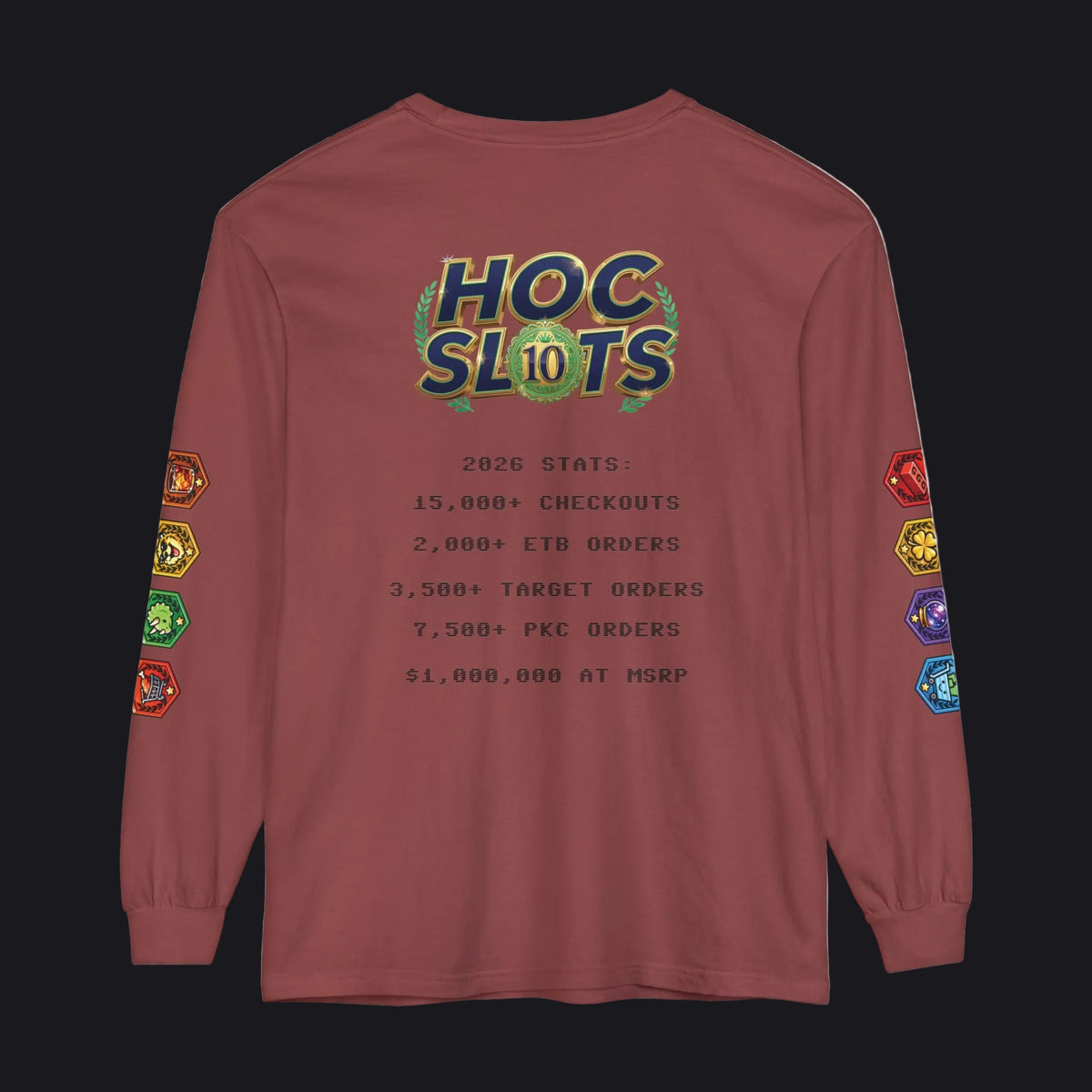 A long-sleeve t-shirt in a dusty rose or mauve color, featuring a 'HOC SLOTS 10' graphic on the back with various gaming statistics printed in black text, and colorful hexagonal patches on both sleeves.