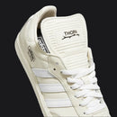 White Adidas sneaker with 'Thorn' branding on a white background