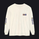 An off-white long-sleeve t-shirt with a small multicolor chest graphic reading 'MVC 51 R179' with military-style ribbons, and 'HOUSE CARDS' printed vertically in navy blue with a gold crown logo on both sleeves.