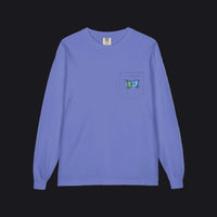 A long-sleeve crewneck shirt in periwinkle blue, featuring a small chest pocket on the left side with a colorful embroidered logo.