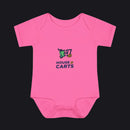 A bright pink short-sleeve baby bodysuit with a colorful graphic on the chest showing a shopping cart and the text 'HOUSE OF CARTS' in navy and green, displayed on a clean white background.