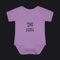 A lavender purple short-sleeve baby bodysuit with a colorful graphic on the chest showing a shopping cart and the text 'HOUSE OF CARTS'.