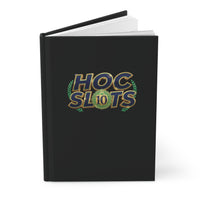 Black notebook with a white symbol on a white background