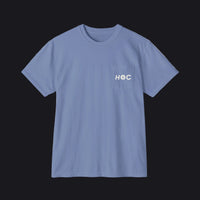 A light blue crewneck pocket t-shirt with a small white graphic on the left chest pocket, displayed flat against a white background.