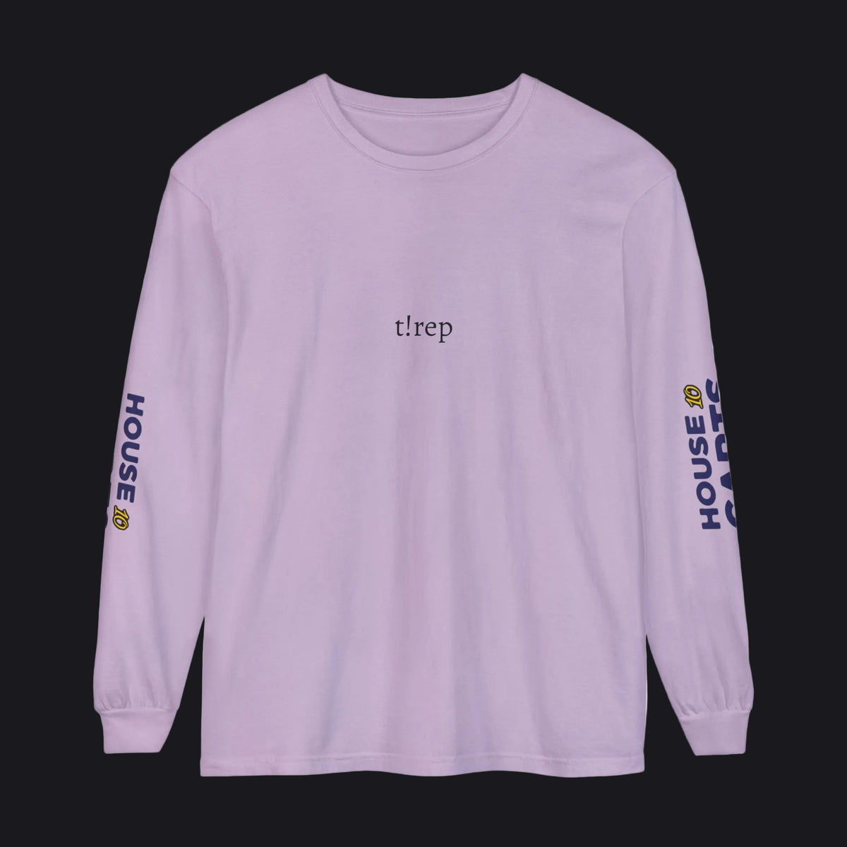 A light purple long-sleeve t-shirt with 'tlrep' printed in black on the chest and 'HOUSE CARDS' in navy with a yellow crown logo on both sleeves, shown on a plain white background.