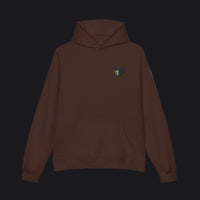 A dark brown pullover hoodie with a small colorful graphic on the left chest, displayed on a clean white background.