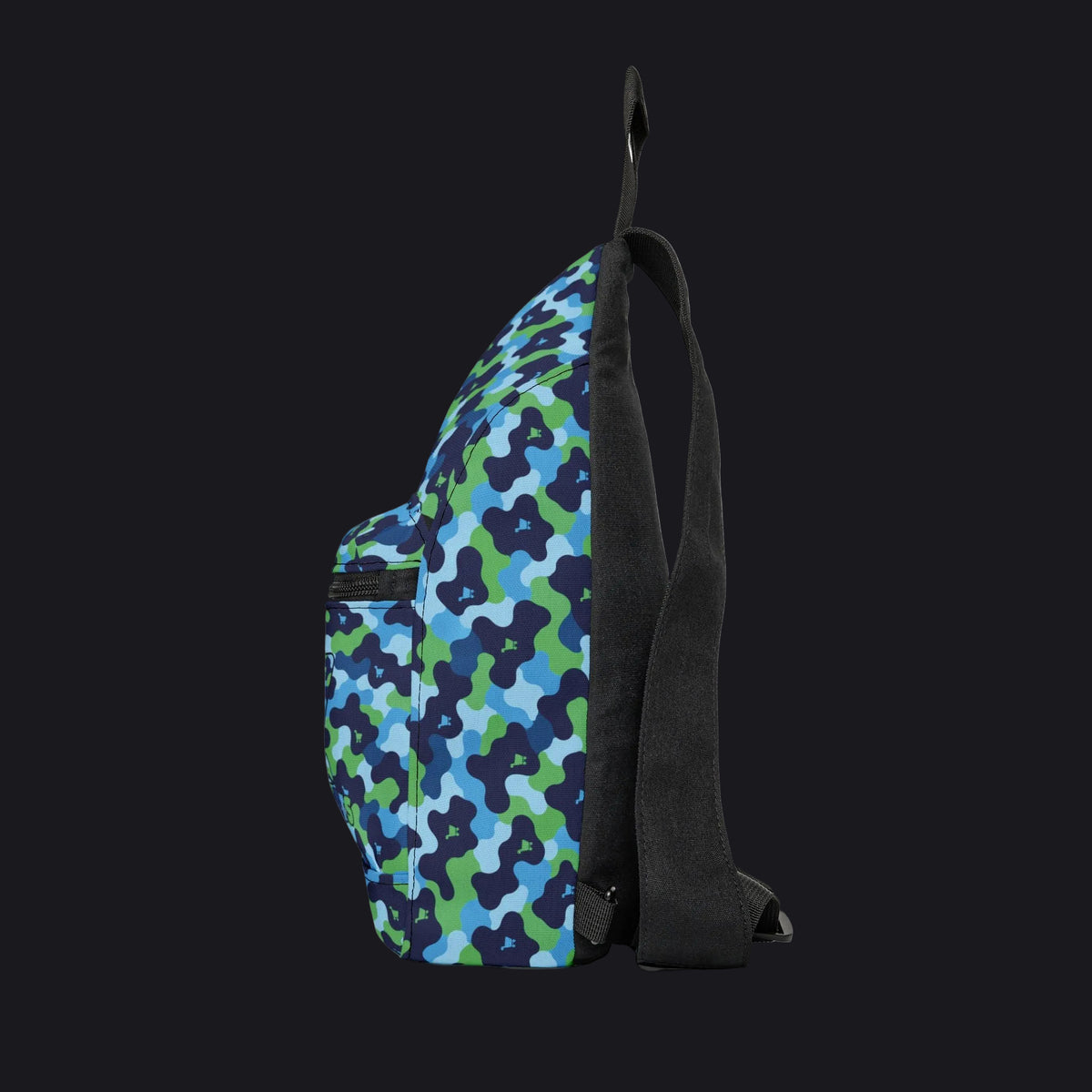 A side profile view of a sling backpack featuring a blue, green, and navy camouflage pattern on the front panel, with a solid black body, strap, and zipper trim, set against a plain white background.