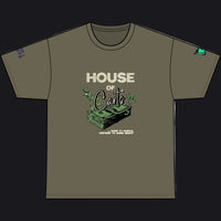 An olive green short-sleeve t-shirt with a graphic on the front reading 'HOUSE OF Cards' above a stack of money and cards, shown on a plain white background.