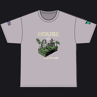 A light gray crewneck t-shirt with a graphic on the front featuring the text 'HOUSE OF Carts' in a distressed cream font above a green illustration of a stack of cash and dollar bills. The t-shirt is shown flat against a solid white background.