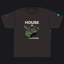 A black short-sleeve t-shirt with a graphic on the front reading 'HOUSE OF Cards' in beige and green, featuring an illustration of a stack of cash and roses. The shirt is displayed flat against a solid white background.