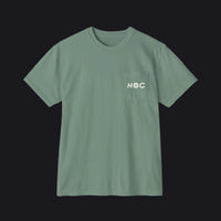 A sage green short-sleeve crewneck pocket t-shirt with 'HOC' printed in white on the chest pocket, shown flat on a white background.