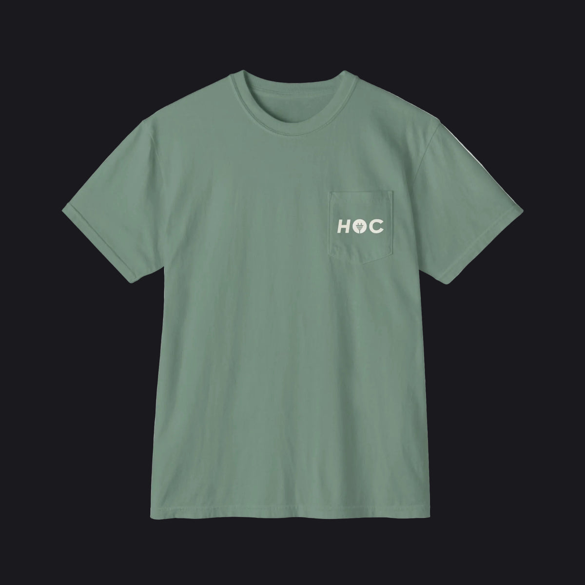 A sage green short-sleeve crewneck pocket t-shirt with 'HOC' printed in white on the chest pocket, shown flat on a white background.