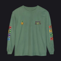 A sage green long-sleeve t-shirt with 'HOC SLOTS' printed on the left chest, a gold emblem on the right chest, and colorful military-style ribbons printed down both sleeves.