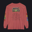A dusty rose long-sleeve t-shirt with a graphic print on the back reading 'HOC SLOTS 2026 STATS' and various colorful hexagonal patches printed down both sleeves, shown against a plain white background.