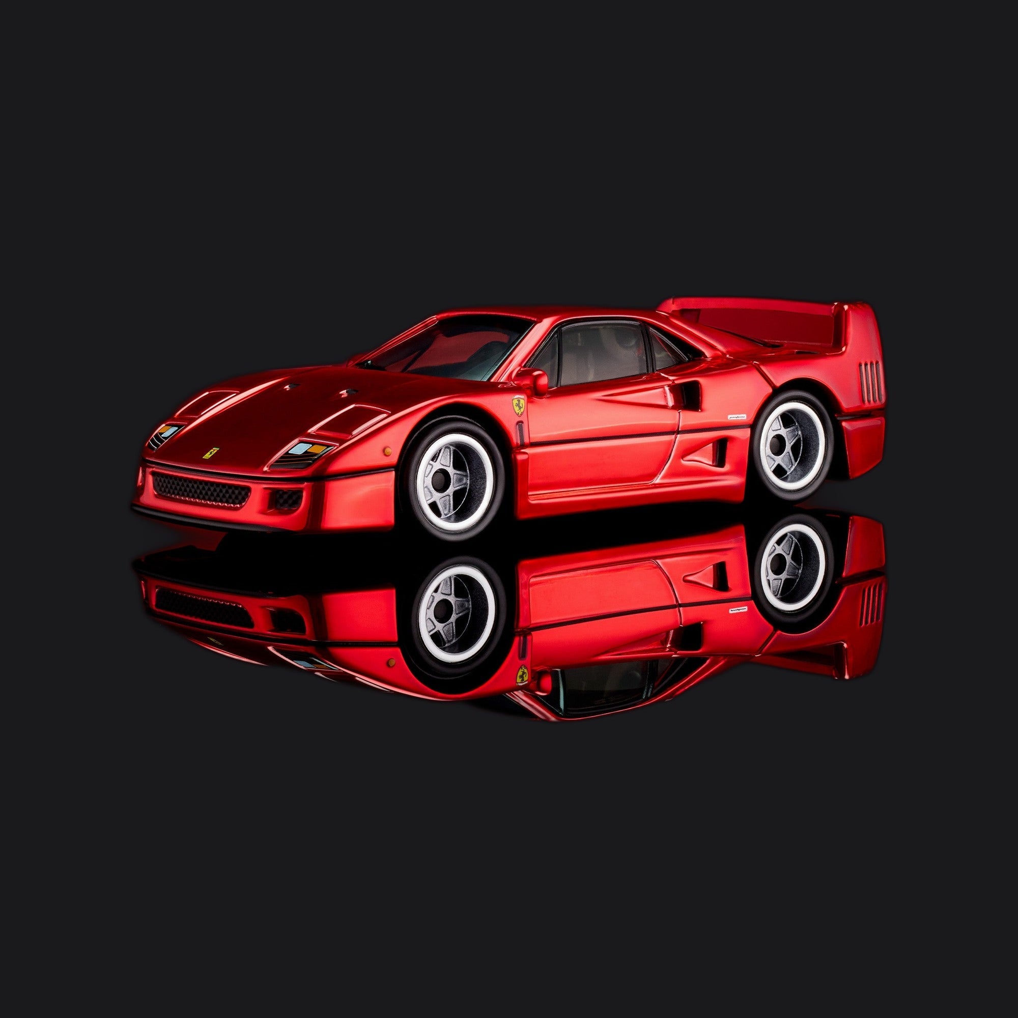 Front three-quarter of the Ferrari F40 die-cast, panels closed, red bodywork under even light.
