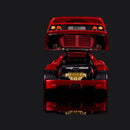 Rear view with the clamshell raised, F40 badge plate and round taillights above the gold exhaust.