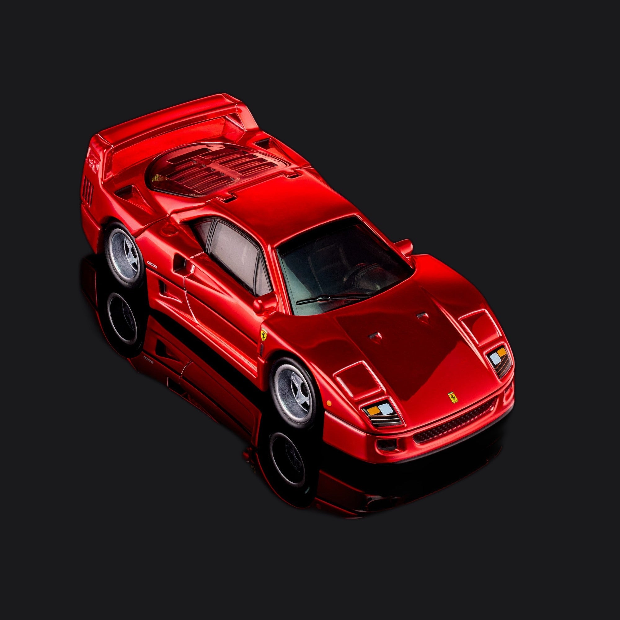 Overhead front three-quarter showing the low bonnet, roofline and louvred engine cover.