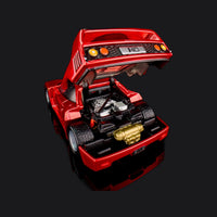 Close rear view with the clamshell propped up over a detailed engine bay and gold manifold.