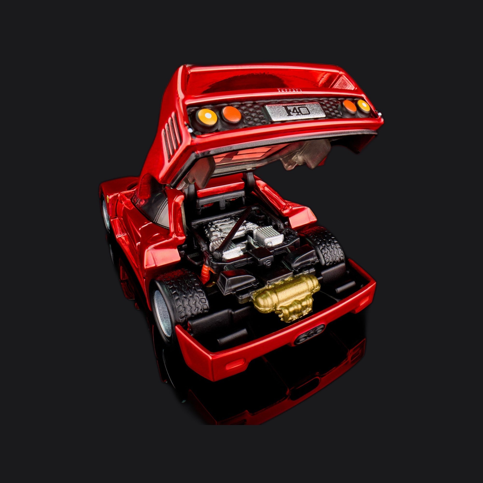 Close rear view with the clamshell propped up over a detailed engine bay and gold manifold.