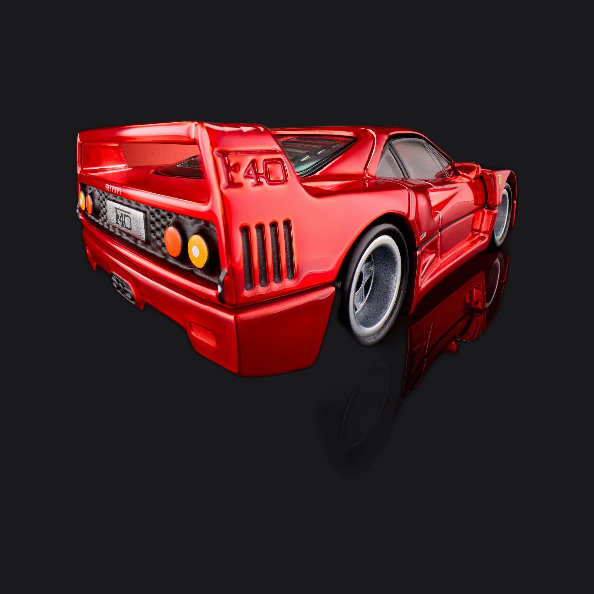 Rear three-quarter close-up with raised F40 lettering on the deck and vented rear fascia.